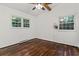 Bedroom with hardwood floors and bright natural light from two windows at 3580 Raymond Dr, Atlanta, GA 30340