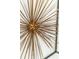 Close up image of a sunburst-like modern art wall decoration at 3580 Raymond Dr, Atlanta, GA 30340