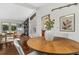 Charming dining room with wood table, fireplace and backyard views at 3580 Raymond Dr, Atlanta, GA 30340