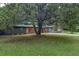 Charming single-Gathering home with a well-manicured lawn and mature trees at 3580 Raymond Dr, Atlanta, GA 30340