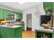 Bright kitchen with green cabinetry and stainless-steel appliances at 3580 Raymond Dr, Atlanta, GA 30340
