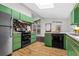 Retro kitchen features colorful tile backsplash, modern appliances, and wood flooring at 3580 Raymond Dr, Atlanta, GA 30340