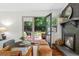 Cozy living room with fireplace and backyard access through sliding glass doors at 3580 Raymond Dr, Atlanta, GA 30340