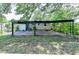 Spacious backyard featuring a covered patio, and fencing, offering ample space for outdoor activities and relaxation at 3991 Adamsville Sw Dr, Atlanta, GA 30331
