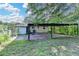Scenic backyard view with a covered patio and fencing, enhancing the outdoor living experience at 3991 Adamsville Sw Dr, Atlanta, GA 30331