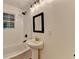 Bathroom featuring a tub, shower head, light fixture and vanity at 3991 Adamsville Sw Dr, Atlanta, GA 30331