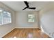 Bright bedroom featuring hardwood floors and natural light from two updated windows at 3991 Adamsville Sw Dr, Atlanta, GA 30331