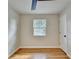 Bedroom featuring hardwood floors, a window, and a white door at 3991 Adamsville Sw Dr, Atlanta, GA 30331