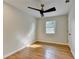 Bedroom with hardwood floors, ample natural light from window, and modern ceiling fan at 3991 Adamsville Sw Dr, Atlanta, GA 30331
