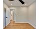 Bedroom featuring hardwood floors, white door, and ample natural light at 3991 Adamsville Sw Dr, Atlanta, GA 30331