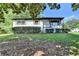 Traditional-style home with landscaped front yard and covered porch entry at 3991 Adamsville Sw Dr, Atlanta, GA 30331