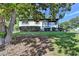Charming single-story home with manicured front yard and mature tree providing shade at 3991 Adamsville Sw Dr, Atlanta, GA 30331