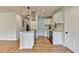 Updated kitchen showcasing white cabinets, granite countertops, and modern lighting fixtures at 3991 Adamsville Sw Dr, Atlanta, GA 30331