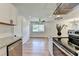 Open concept kitchen with granite countertops, stainless steel appliances and hardwood floors at 3991 Adamsville Sw Dr, Atlanta, GA 30331