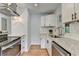 Galley-style kitchen with stainless steel appliances, granite countertops, and updated cabinets at 3991 Adamsville Sw Dr, Atlanta, GA 30331