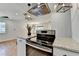 Modern kitchen with granite countertops, stainless steel appliances and a view of the living space at 3991 Adamsville Sw Dr, Atlanta, GA 30331