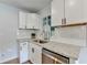Bright kitchen with granite countertops, subway tile backsplash, and modern fixtures at 3991 Adamsville Sw Dr, Atlanta, GA 30331