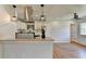 Eat-in kitchen with granite countertops, stainless appliances, and modern pendant lights at 3991 Adamsville Sw Dr, Atlanta, GA 30331