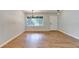 Bright living room featuring hardwood floors and a large window at 3991 Adamsville Sw Dr, Atlanta, GA 30331