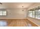 Spacious living room with hardwood floors and large windows providing natural light at 3991 Adamsville Sw Dr, Atlanta, GA 30331