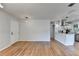 Open floor plan displaying hardwood floors, light colored walls, and a view into the modern kitchen at 3991 Adamsville Sw Dr, Atlanta, GA 30331