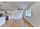 Bright room with new hardwood floors and a seamless view into the beautifully renovated kitchen at 3991 Adamsville Sw Dr, Atlanta, GA 30331