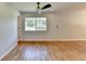 Bright living room featuring a modern ceiling fan and hardwood floors at 3991 Adamsville Sw Dr, Atlanta, GA 30331