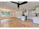 Open-concept living space with hardwood floors, modern lighting, and kitchen at 3991 Adamsville Sw Dr, Atlanta, GA 30331