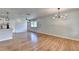 Open-concept living space with modern lighting and beautiful hardwood floors at 3991 Adamsville Sw Dr, Atlanta, GA 30331