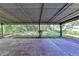 Covered outdoor patio offering a cozy spot to relax while enjoying the expansive backyard view at 3991 Adamsville Sw Dr, Atlanta, GA 30331