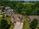 Aerial shot showcasing the home's backyard, landscaping, and neighborhood at 4305 Hunters Walk Way, Cumming, GA 30028