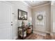 Inviting foyer with hardwood floors, a stylish console table, and neutral decor at 4305 Hunters Walk Way, Cumming, GA 30028