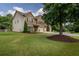 Lovely two-story home featuring a spacious lawn and a charming brick and siding exterior at 4305 Hunters Walk Way, Cumming, GA 30028