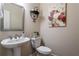 Half bathroom featuring a pedestal sink and toilet at 4305 Hunters Walk Way, Cumming, GA 30028
