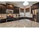 Gourmet kitchen featuring stainless steel appliances and granite countertops at 4305 Hunters Walk Way, Cumming, GA 30028
