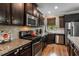 Gourmet kitchen featuring stainless steel appliances and granite countertops at 4305 Hunters Walk Way, Cumming, GA 30028