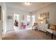 Bright loft area with access to other rooms, styled with chairs and décor at 4305 Hunters Walk Way, Cumming, GA 30028