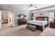 Spacious main bedroom with decorative bed, dresser, and neutral decor at 4305 Hunters Walk Way, Cumming, GA 30028