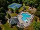 Aerial view of community pool, tennis courts, and playground, offering residents diverse recreational options at 4305 Hunters Walk Way, Cumming, GA 30028