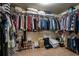 Organized walk-in closet featuring built-in shelving, hanging racks, and shoe storage at 4305 Hunters Walk Way, Cumming, GA 30028