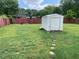 Spacious backyard featuring a shed, lawn, and wooden fence at 60 King Blvd, Mcdonough, GA 30253