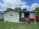 Back of home showcasing a covered porch and a fenced yard perfect for outdoor enjoyment at 60 King Blvd, Mcdonough, GA 30253