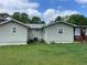 A view of the home's backyard, including a covered porch at 60 King Blvd, Mcdonough, GA 30253