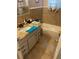 Bathroom featuring a tiled vanity with granite counters, a tub, and decorative accents at 60 King Blvd, Mcdonough, GA 30253