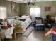 Bedroom with an armchair, bed and decorative painting at 60 King Blvd, Mcdonough, GA 30253