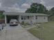 Charming one-story home with a covered carport and a well-maintained front yard at 60 King Blvd, Mcdonough, GA 30253