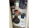 Close up of the laundry area featuring a washer, dryer, and shelving unit at 60 King Blvd, Mcdonough, GA 30253