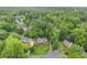 An aerial view of the home's lush landscaping, mature trees, and circular driveway at 1540 Kinglet Ln, Marietta, GA 30062