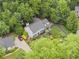 Charming two-story home boasts mature landscaping, a long driveway and attached garage at 1540 Kinglet Ln, Marietta, GA 30062