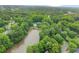 Aerial view of the lake near the neighborhood, with mature trees and lush greenery at 1540 Kinglet Ln, Marietta, GA 30062